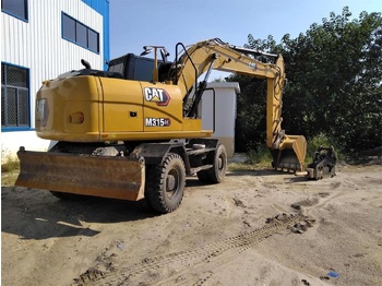 Escavadeira de rodas CATERPILLAR M315